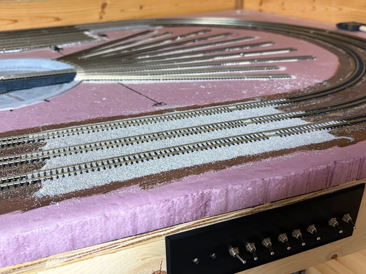 Started ballasting on the souther side of roundhouse curve. Day 5 of scenery