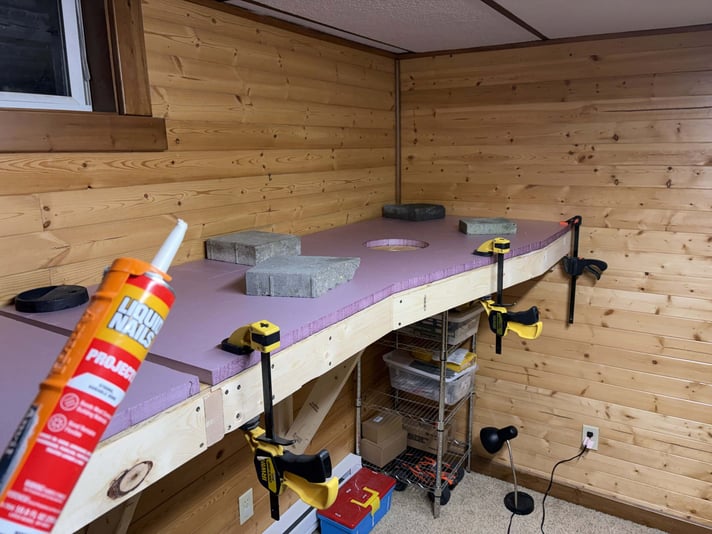 Gluing down the first foam panel, day 6 of benchwork construction