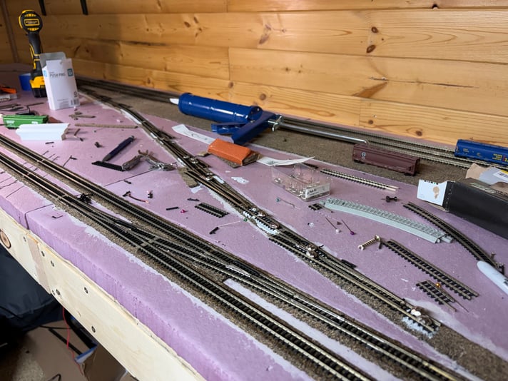 The last switches of the yard ladder gluing down, Day 25 of track work
