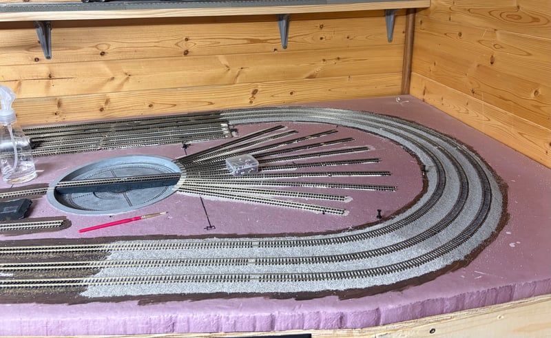 Roundhouse curve fully ballasted. Day 7 of scenery
