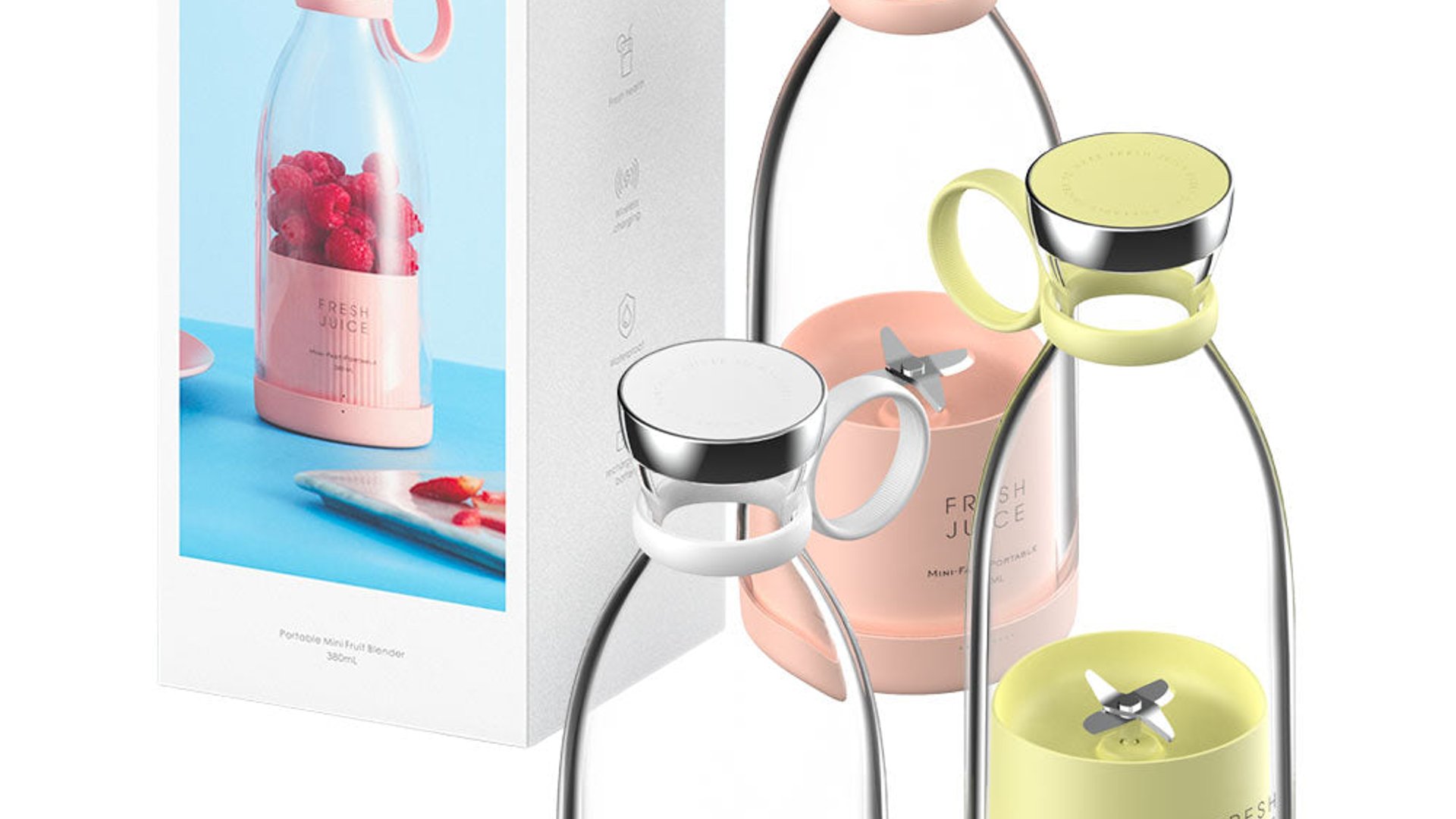 Portable blender with fruit on a pink background