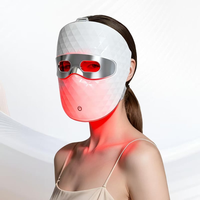 The mask and the neck panel worn together, lit red