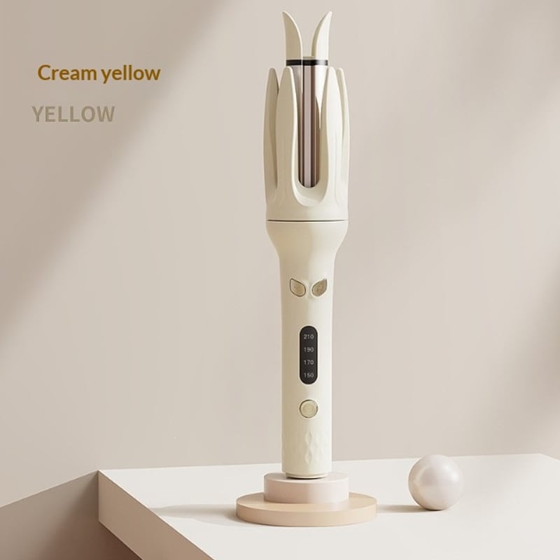 The automatic hair curler in cream yellow