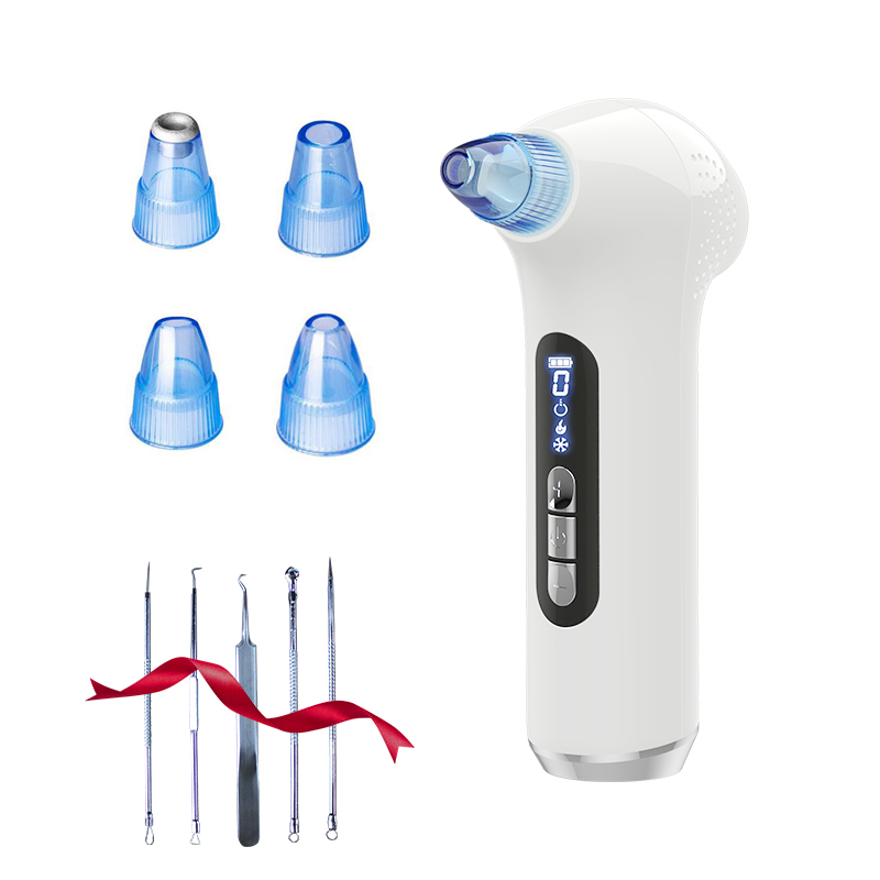 Pore vacuum with its four replacement heads and extractor tools