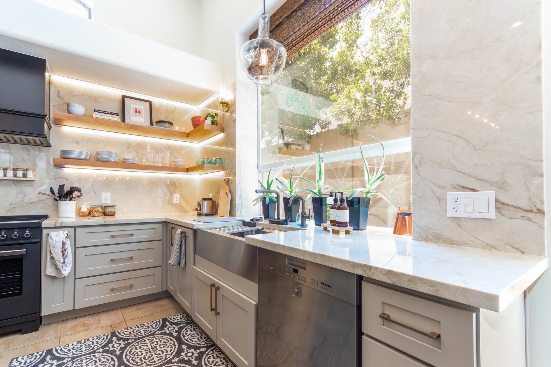 Bright transitional kitchen with large island and integrated appliances