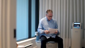 Man recieving men's pelvic floor therapy and kegel chair treatment at at UROSPOT