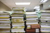 A stack of files on a desk