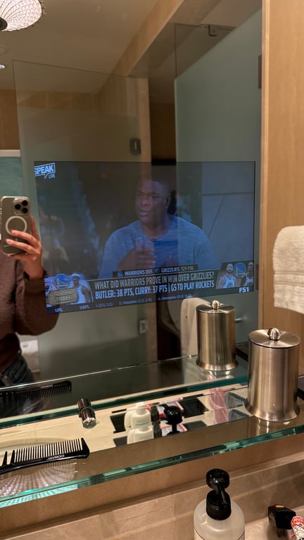 Have you ever seen a TV in the mirror of a hotel bathroom before?