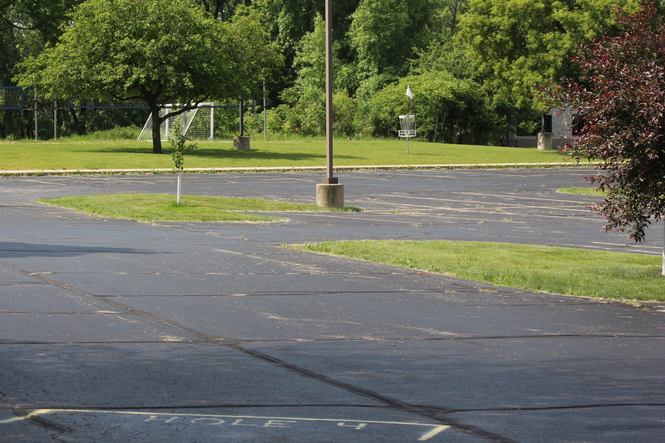 #4: ~230' OB carry over the parking lot. OB goes to drop zone on sidewalk. Volleyball court plays as hazard.