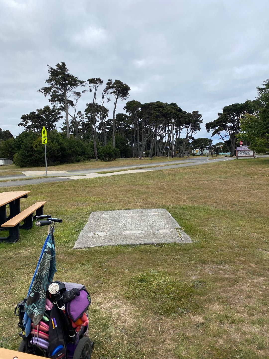 Tee pad looking toward the basket, for Hole 1A on the Bandon 30 Layout.
