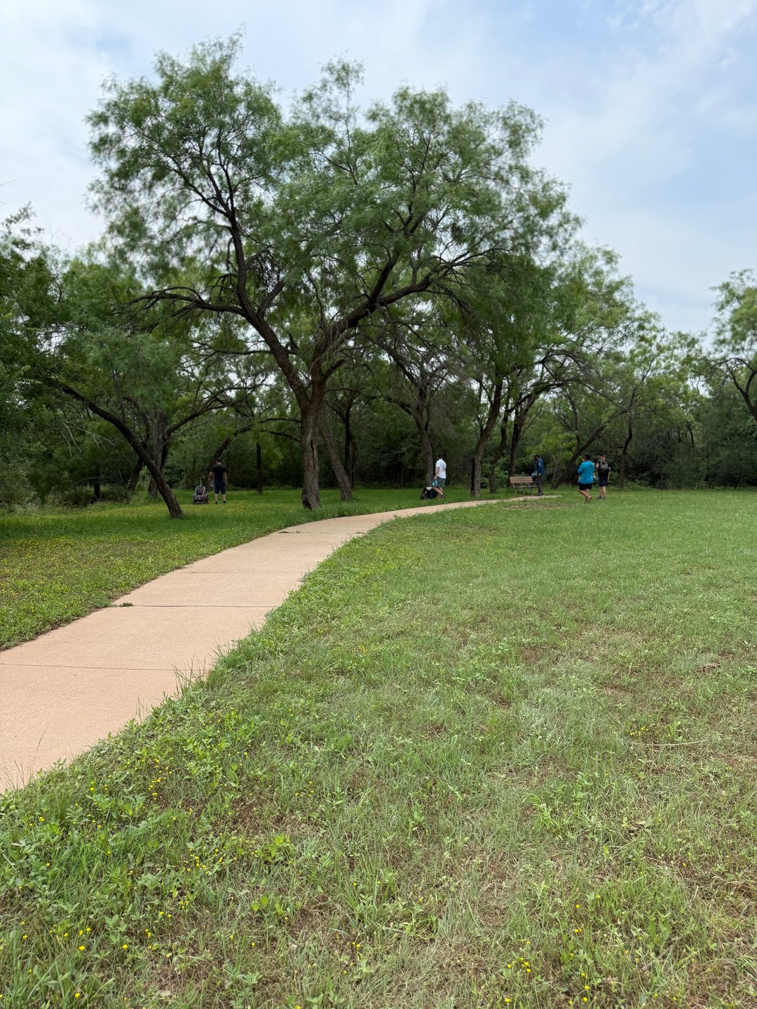People approaching the green for Hole 3. 