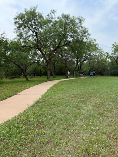 People approaching the green for Hole 3. 