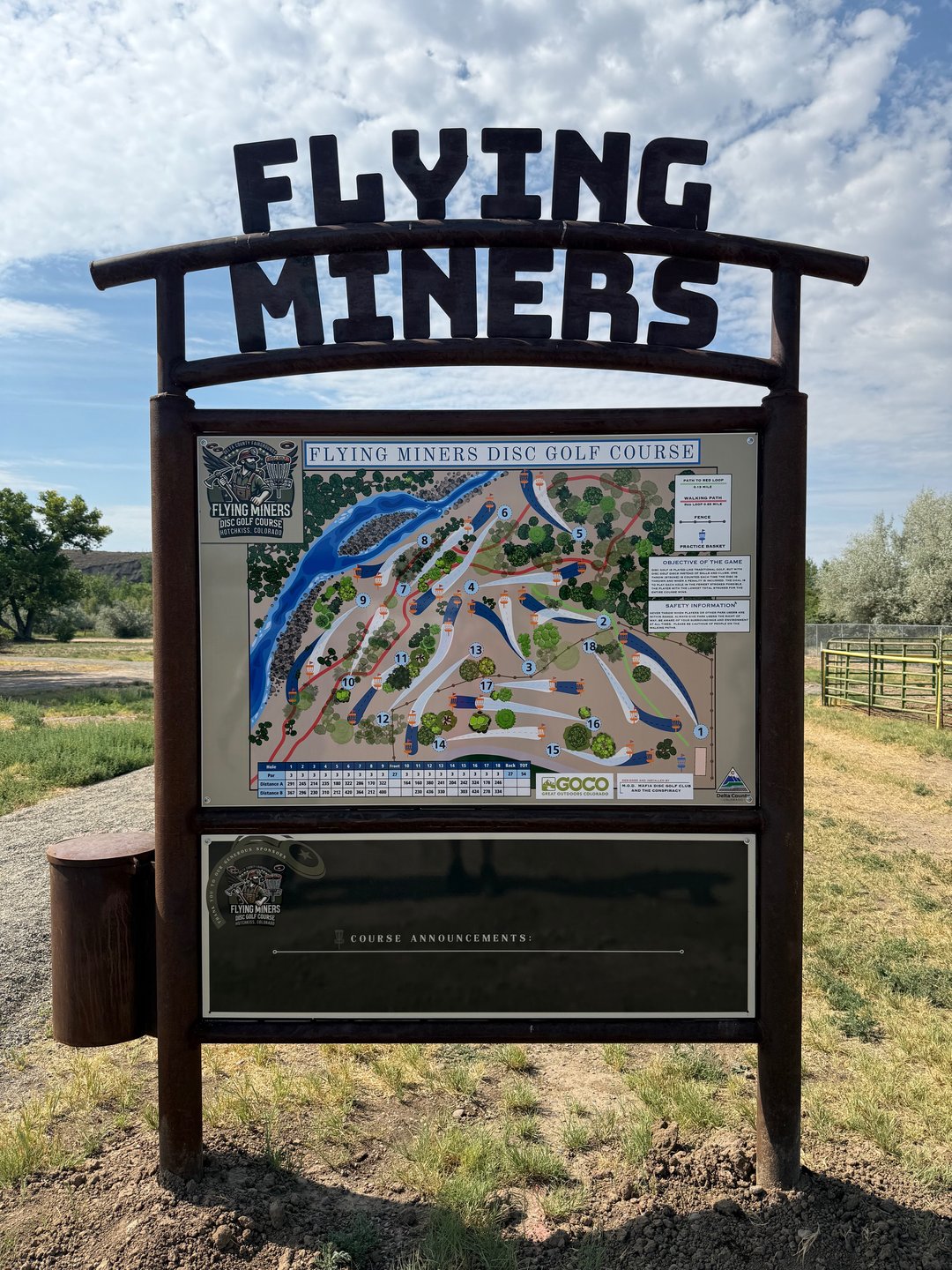 The New Course Sign and drop box located next to the parking area.