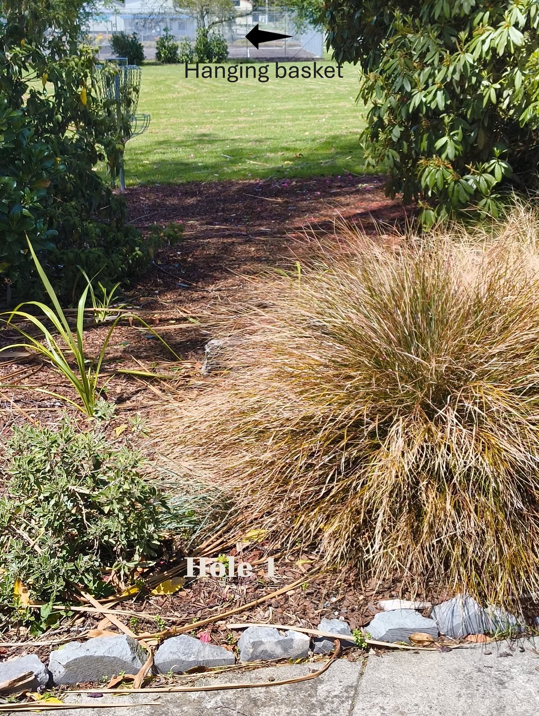 Tee next to Showgrounds entry gate from pavement