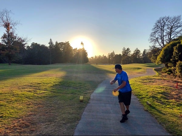 Tee of hole 3 at sunset, featuring course designer Jon Baldwin.
