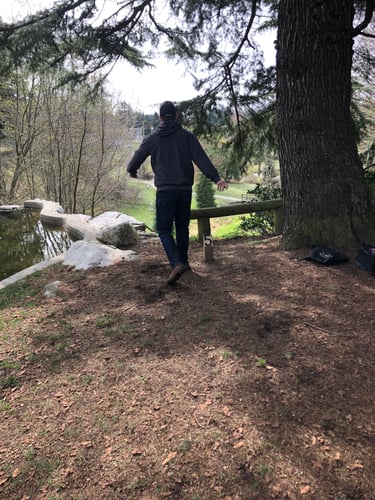 Teeing off atop the old waterfall on hole 5. 