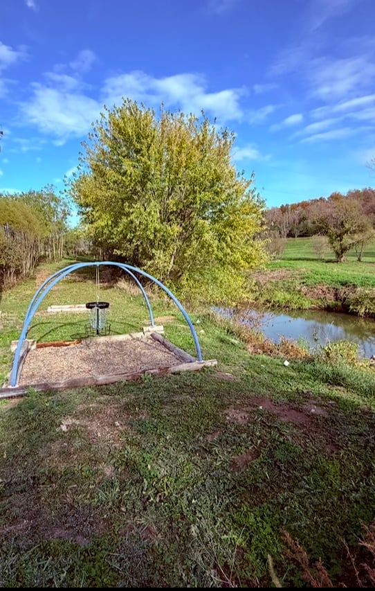Hole 14 - “Cascades” - Green looking back to tee. OB creek to left and Hazard right and long. 