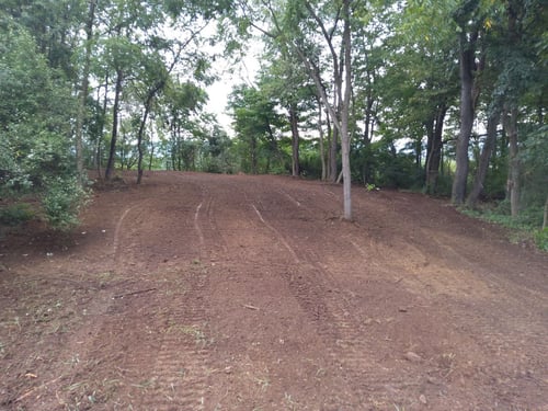 Preparing for seeding the green on Hole 3 at Faylor Lake