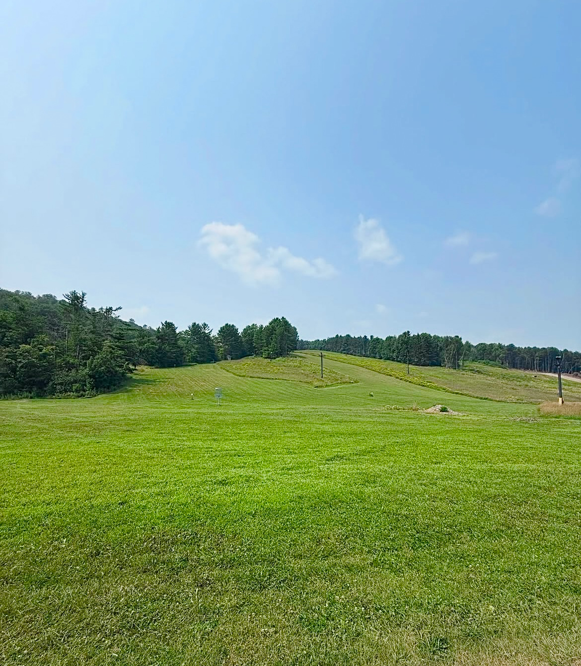Hole 16 green looking back at upper fairway and hole 15 baskets