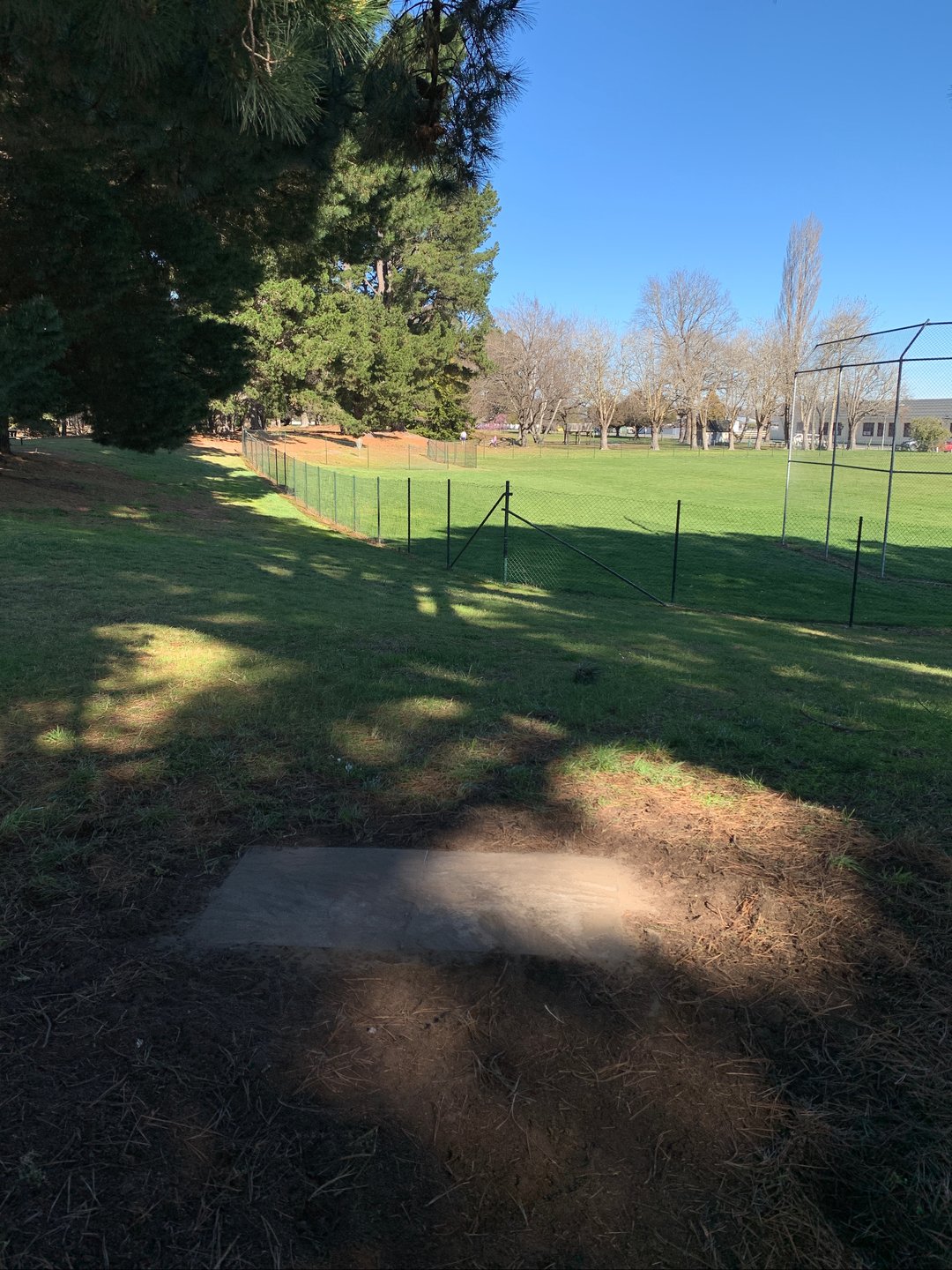 Hole 9 tee pad. Hazard right side of fenced area 