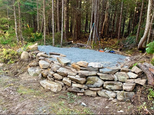 Raised tee pad with stone stairs. 
Hand made by course designer Ben Smith. 