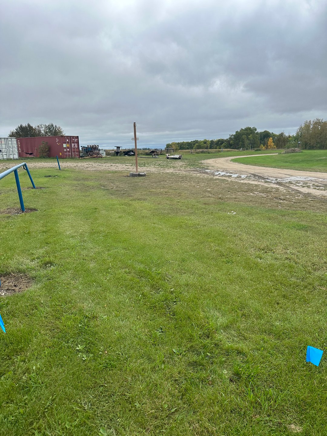 Hole 3: Beyond fence and gravel road out of bounds.

