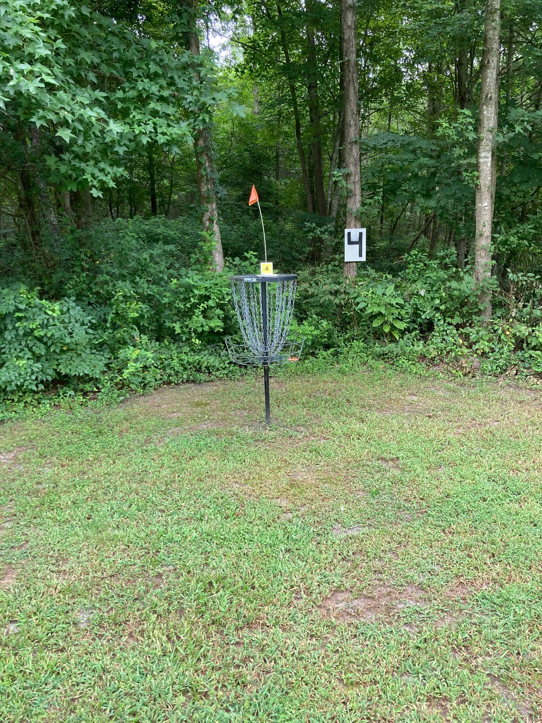 Hole 4 basket is just right of maintenance shed

Hole 8s basket is along the wood line (far right side)