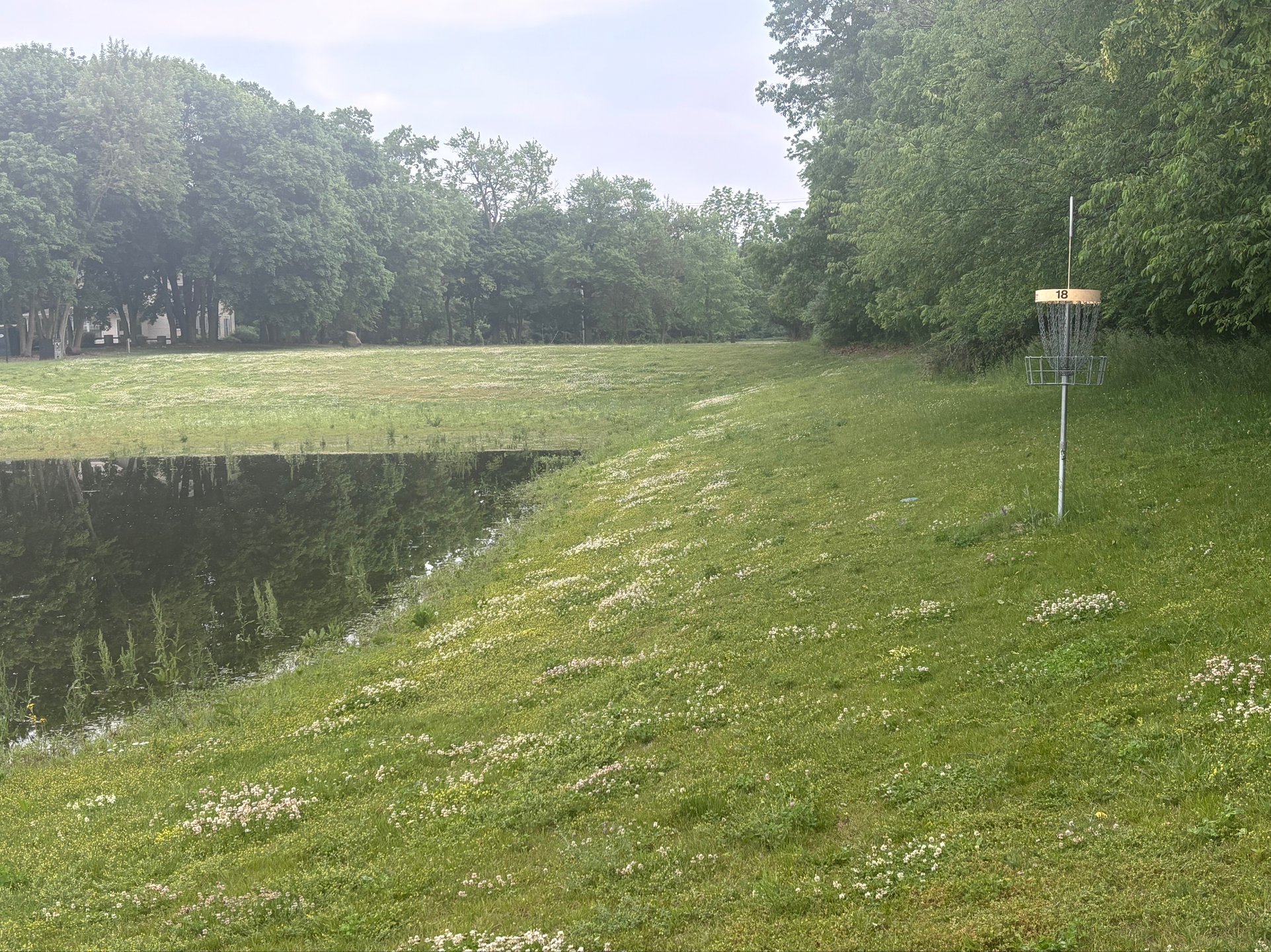 The green at hole 18 requires a precise approach shot and perhaps a risky putt into the elevated basket.