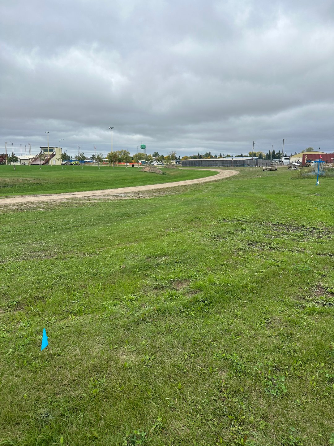 Hole 4: Gravel road and beyond fence is out of bounds. 