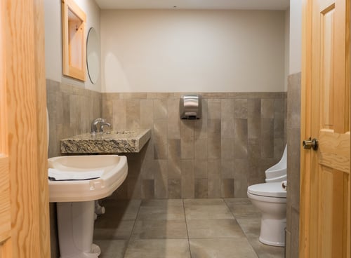 Clean restroom with baby changing station