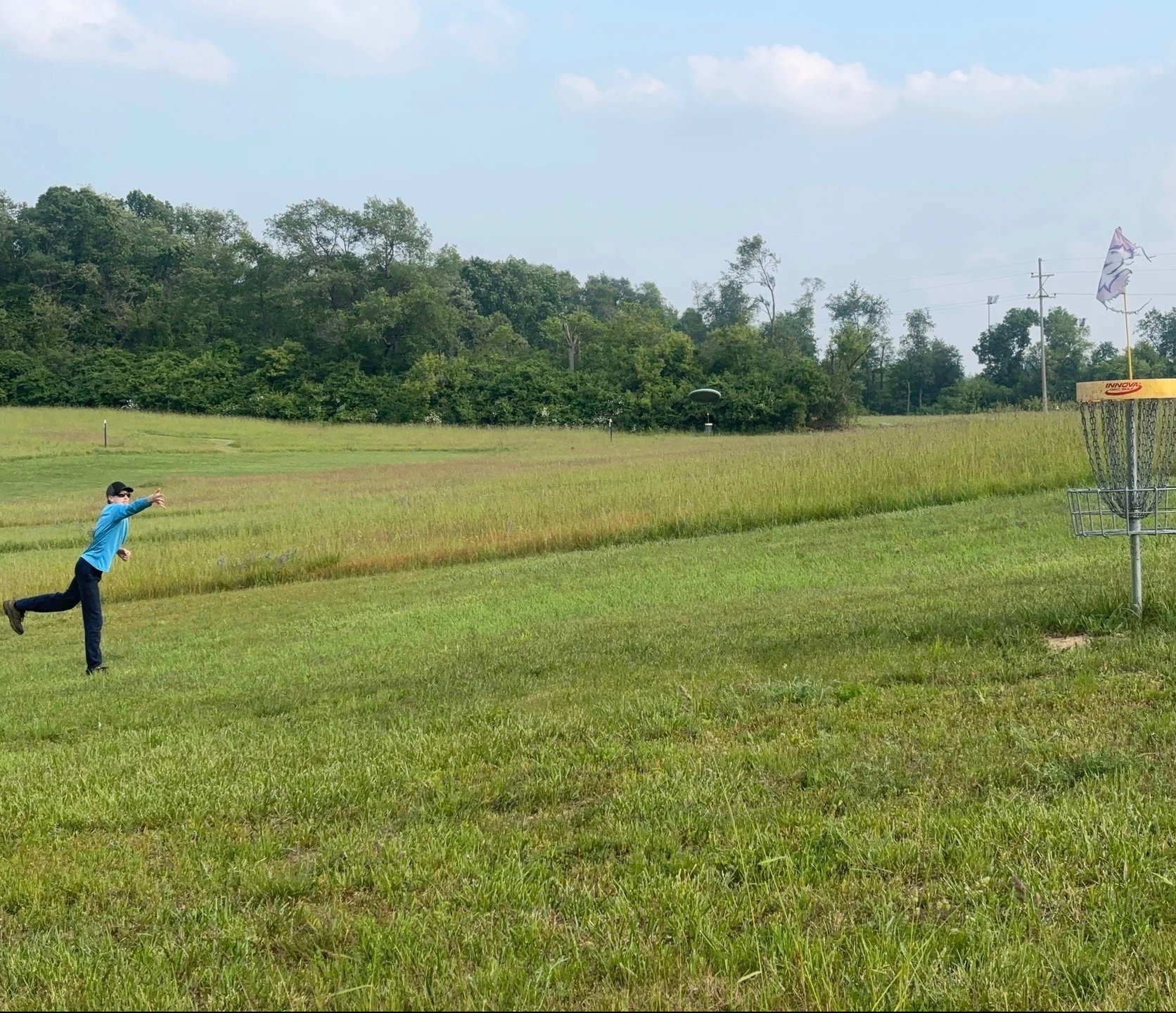 Putting on hole 5 with the open winding fairway in the background.