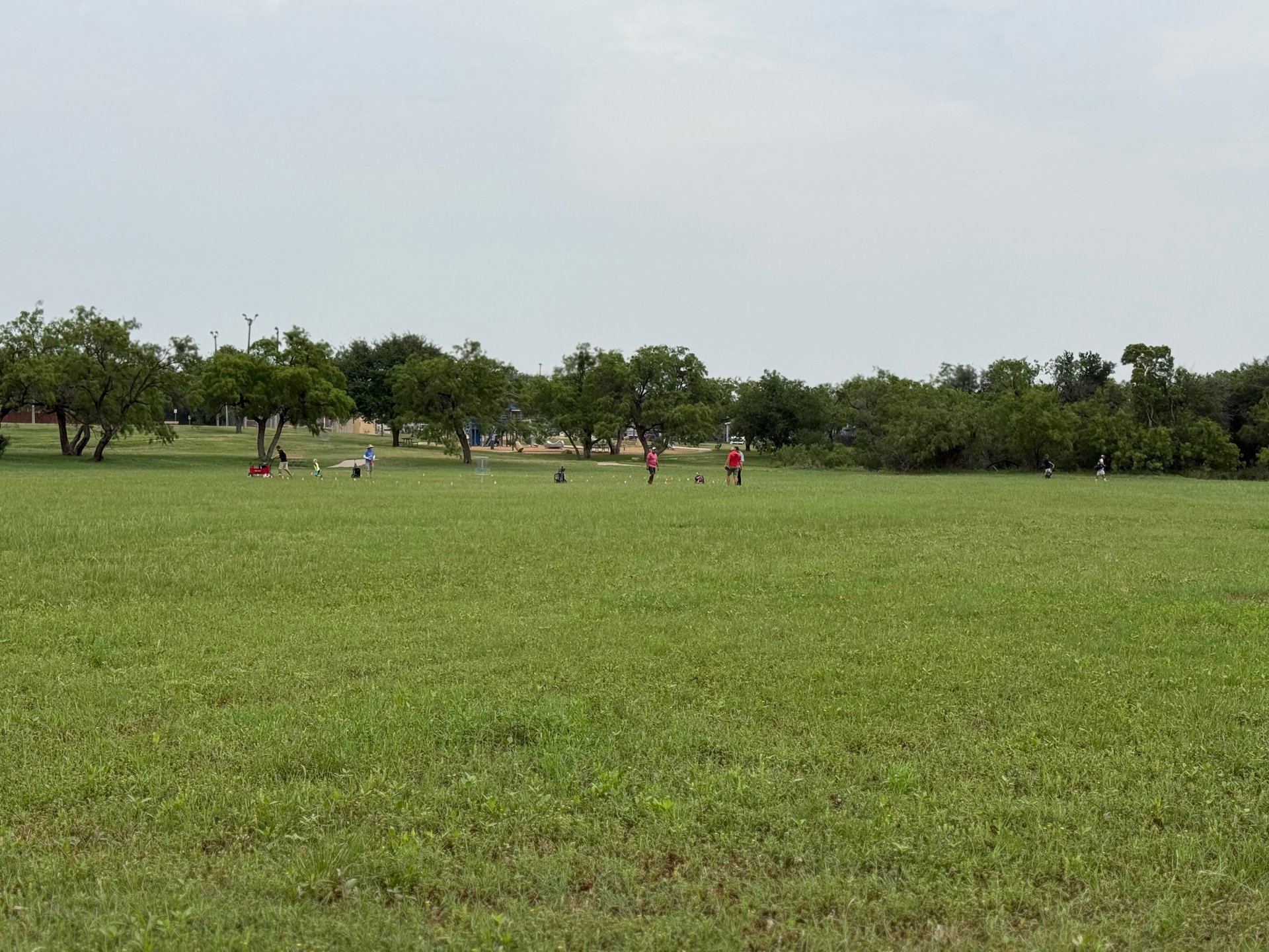 People playing the (temporary) island hole (Hole 2). 