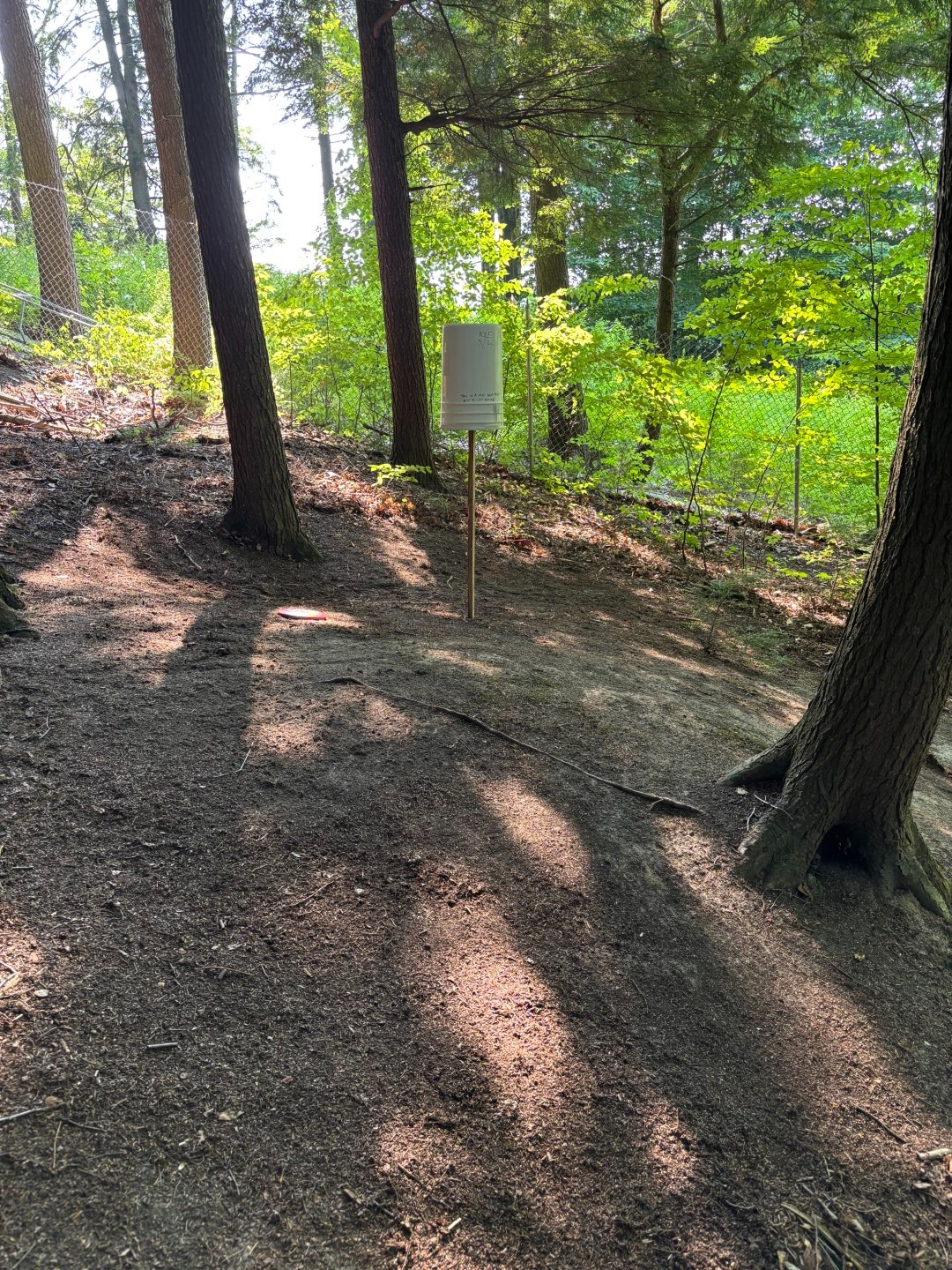 5/14 bucket. OB over chain link fence at back of green