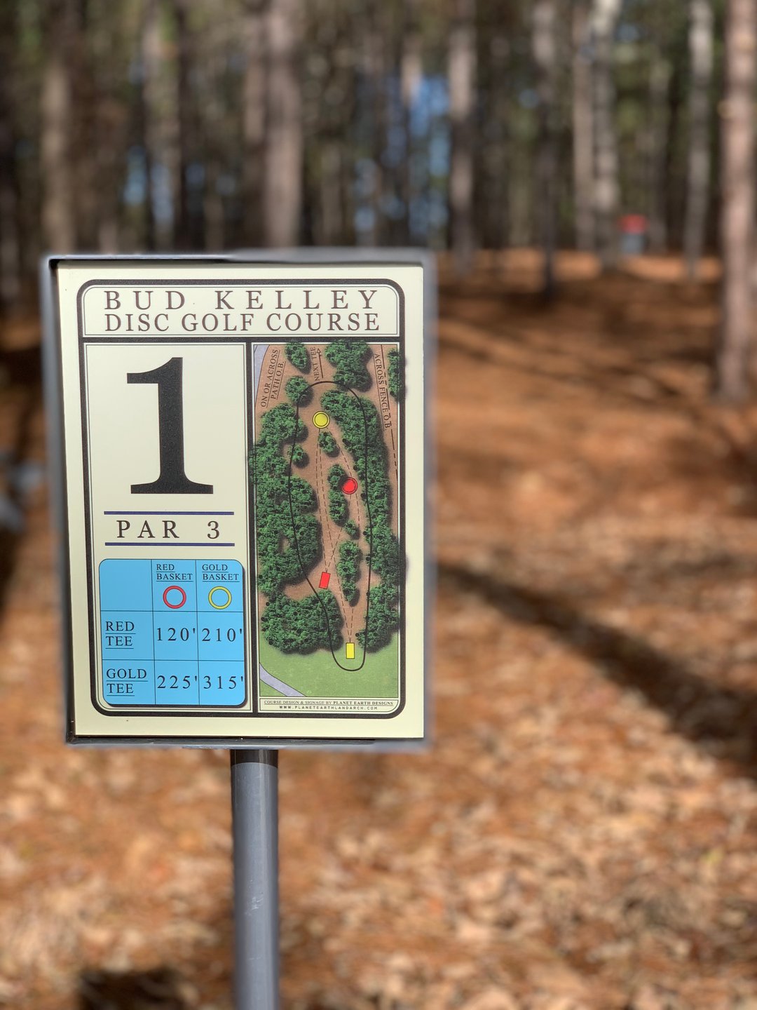 Hole 1 Red tee sign and basket in background. 