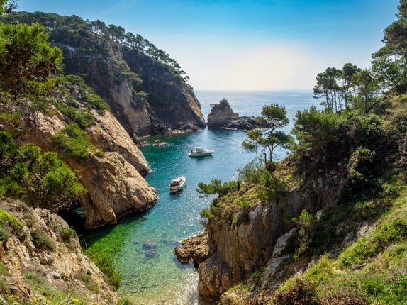 View of secluded cove with emerald green water near Palamos, Catalonia
