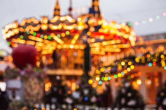 Blurred photo of Christmas carousel at the fair near GUM shop on Red Square in Moscow