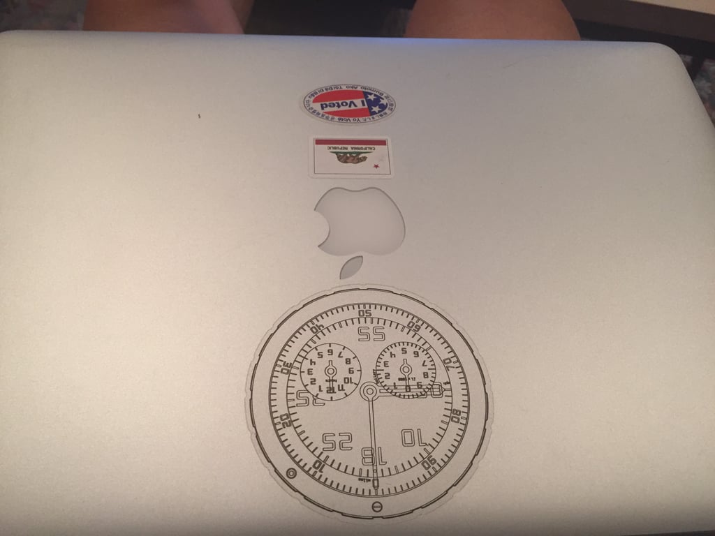 An OMATA instrument drawing on the laptop lid.