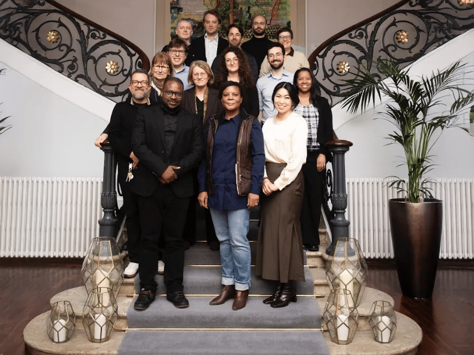 Attendees in a group photo at the AI Policy and Governance Working Group workshop