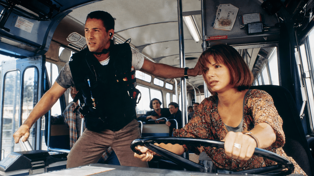 Speed film still showing the bus interior and its drivers.