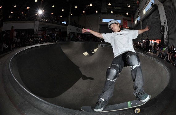 A skateboarder performing a Smith grind.
