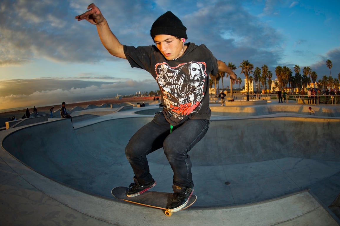 A skateboarder performing a Smith grind.