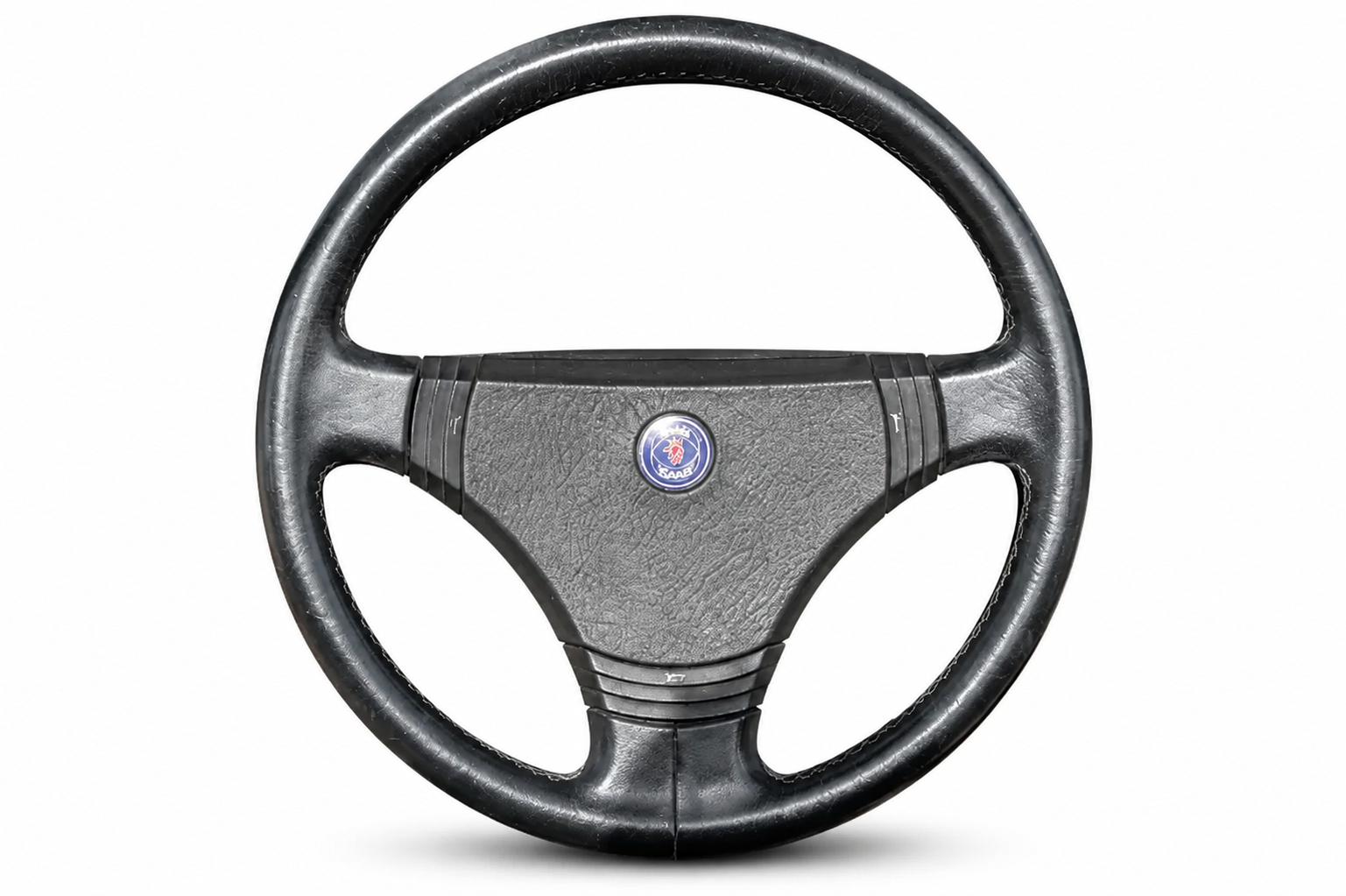 Black SAAB Convertible steering wheel with a central SAAB logo on a white background.