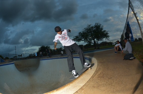 A skateboarder performing a Smith grind.