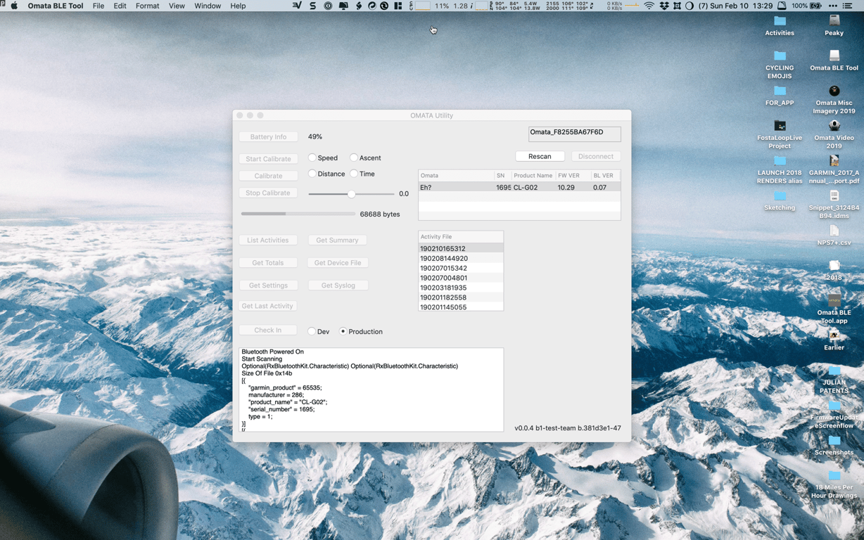 The OMATA BLE Tool desktop utility showing device information, activity files, calibration, firmware, and serial output over a mountain desktop.
