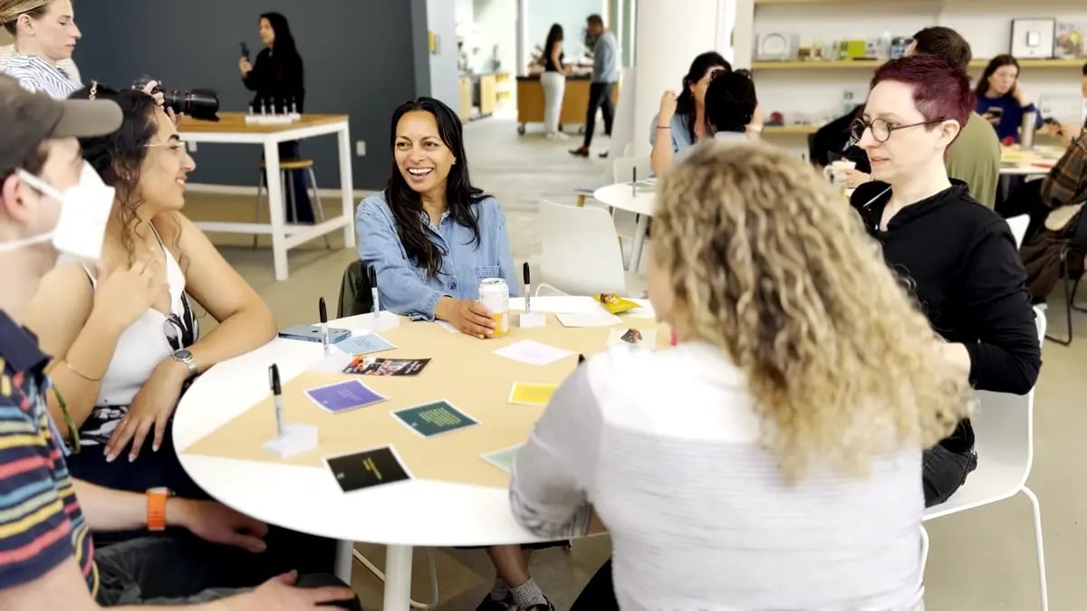 A futures design workshop with people smiling