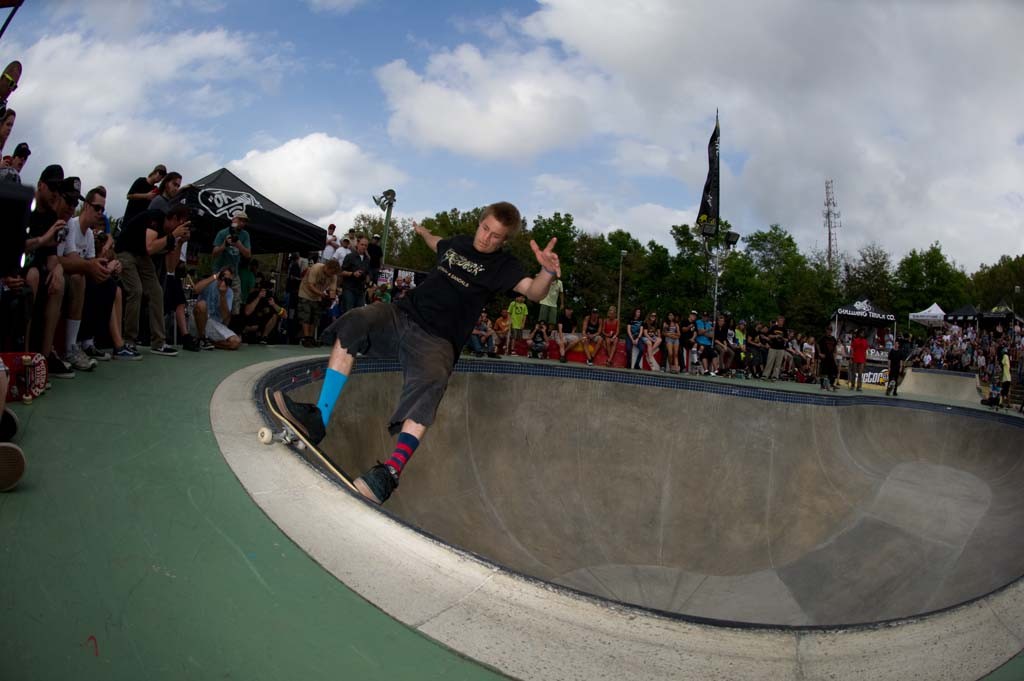 A skateboarder performing a Smith grind.