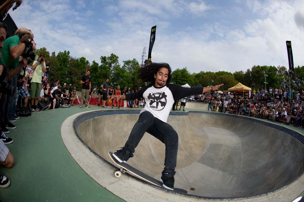 A skateboarder performing a Smith grind.
