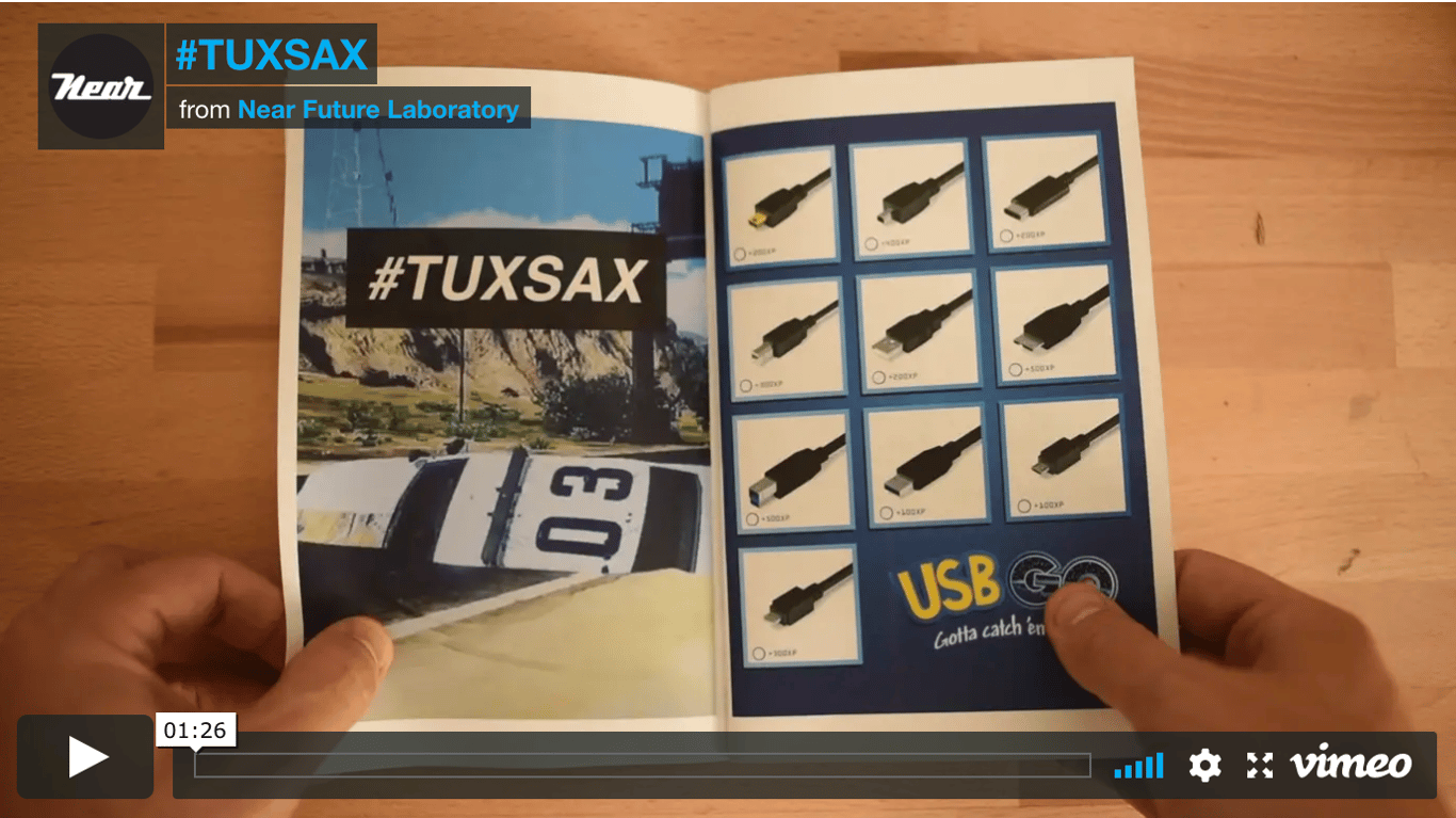 A Vimeo player screenshot showing the TUXSAX book opened to a spread of USB connector illustrations.