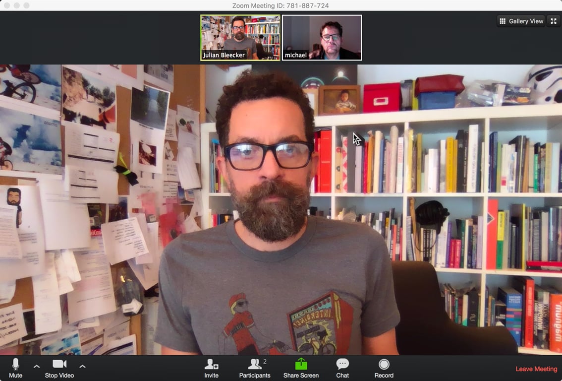 A video call from the studio, surrounded by books and pinned notes.