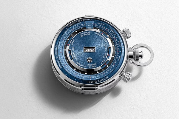 Intricate blue and silver timepiece with calendar markings and year 2025 displayed.